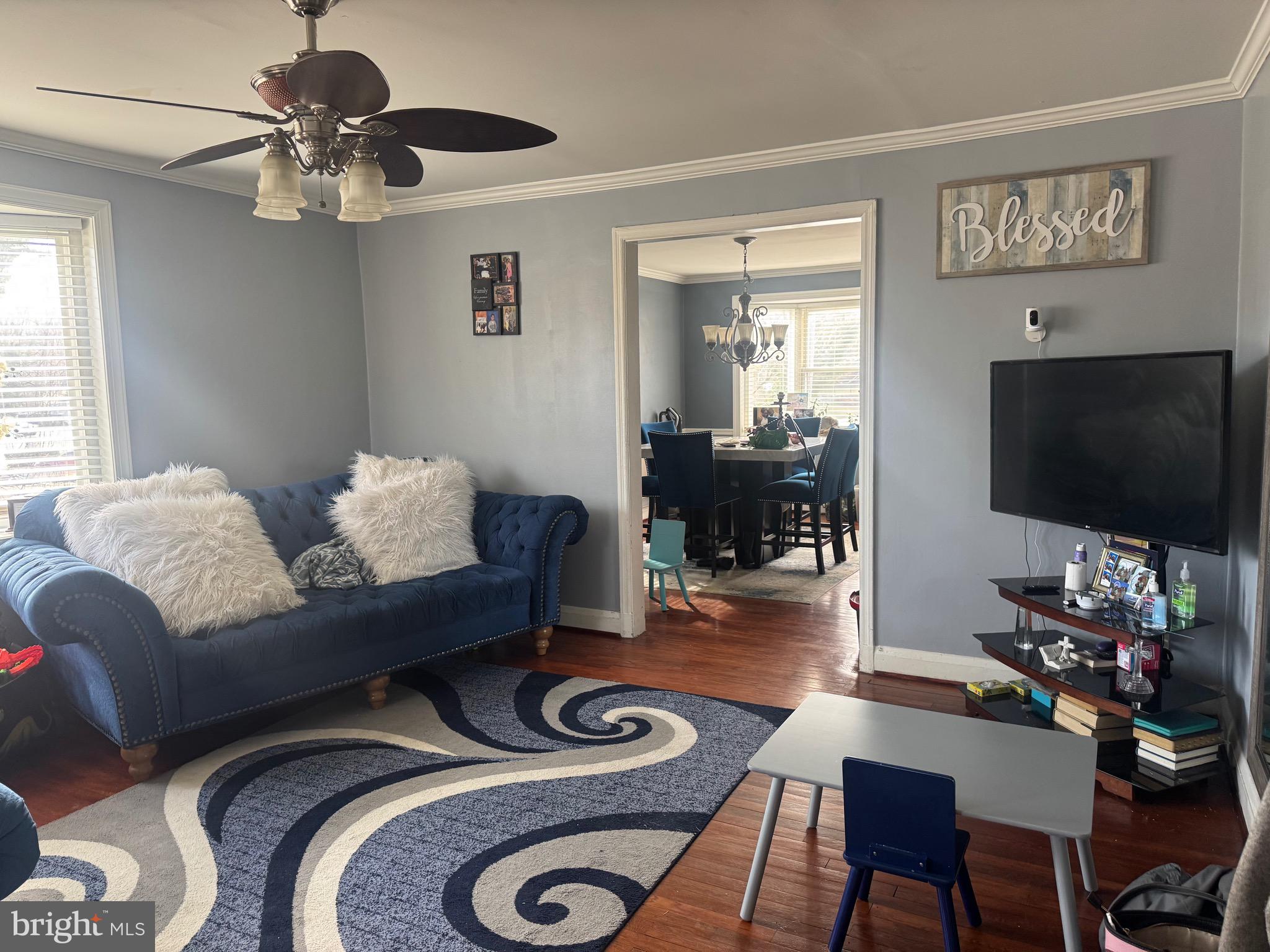 1653 Stonewood Road Baltimore, MD 21239 - Photo 3 of 17 a living room with furniture and a flat screen tv