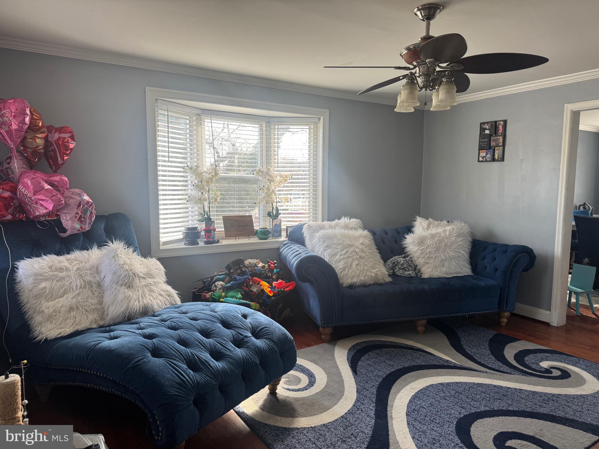 1653 Stonewood Road Baltimore, MD 21239 - Photo 4 of 17 a living room with furniture and a window