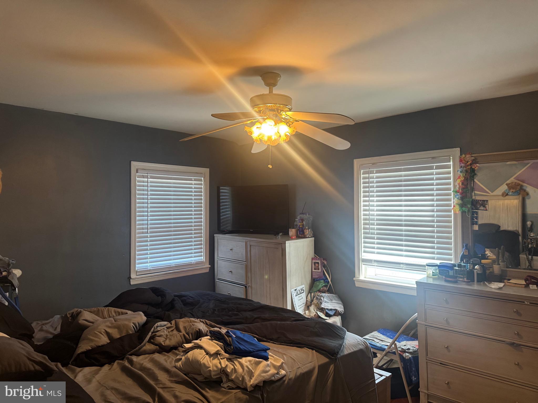 1653 Stonewood Road Baltimore, MD 21239 - Photo 9 of 17 a bedroom with a bed and window