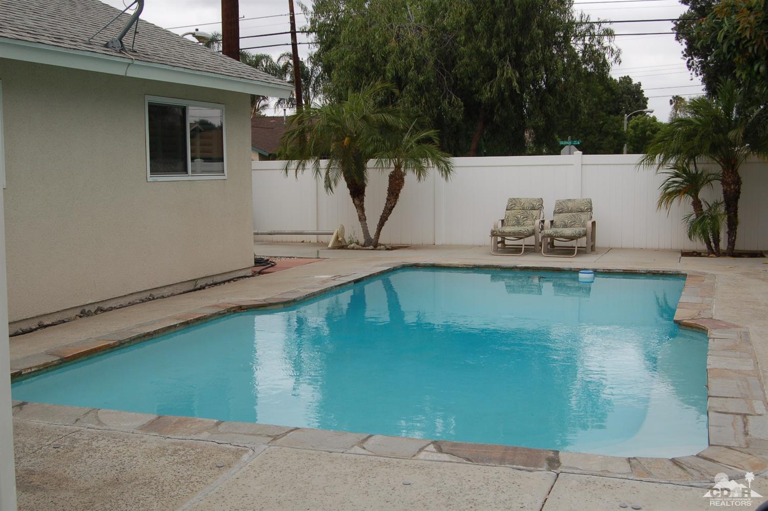 4591 Toyon Road Riverside, CA 92504 - Photo 1 of 40 a front view of a house with garden
