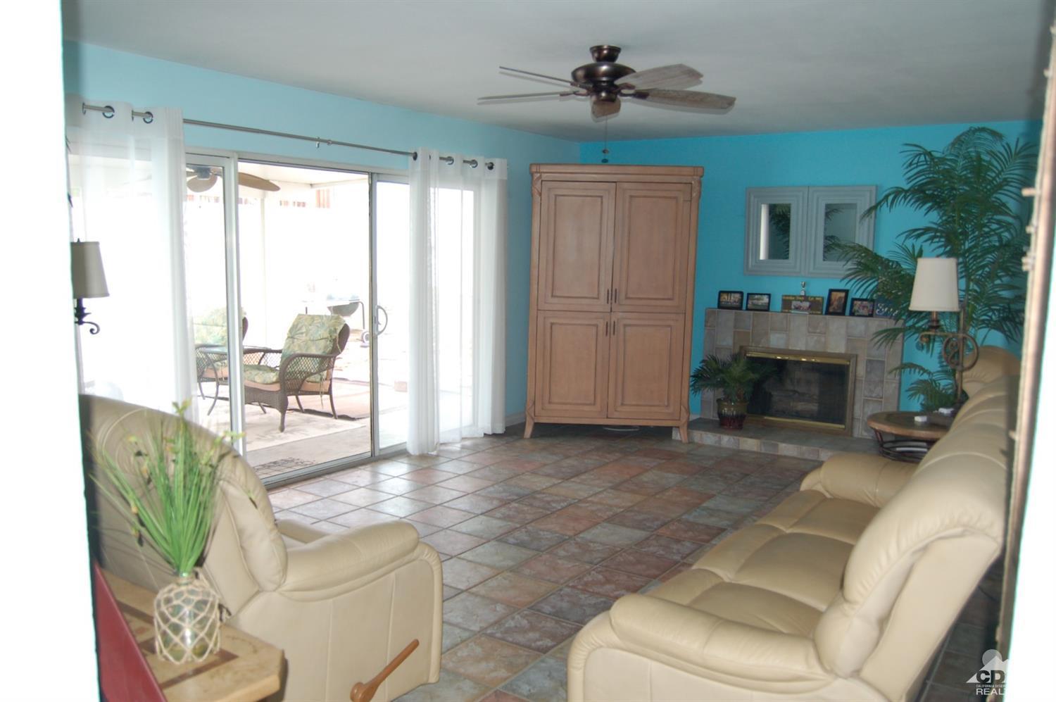 4591 Toyon Road Riverside, CA 92504 - Photo 11 of 40 a living room with furniture a window and a fireplace