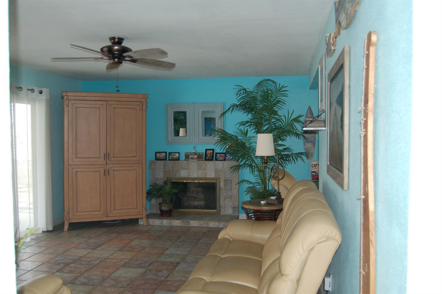 4591 Toyon Road Riverside, CA 92504 - Photo 12 of 40 a living room with furniture and a fireplace