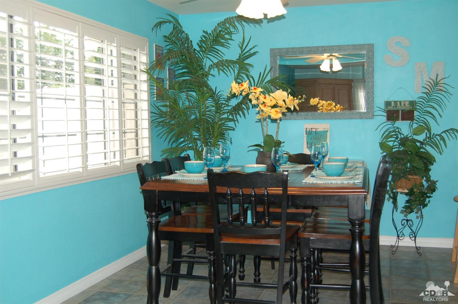 4591 Toyon Road Riverside, CA 92504 - Photo 15 of 40 a view of a dining room with furniture and chandelier
