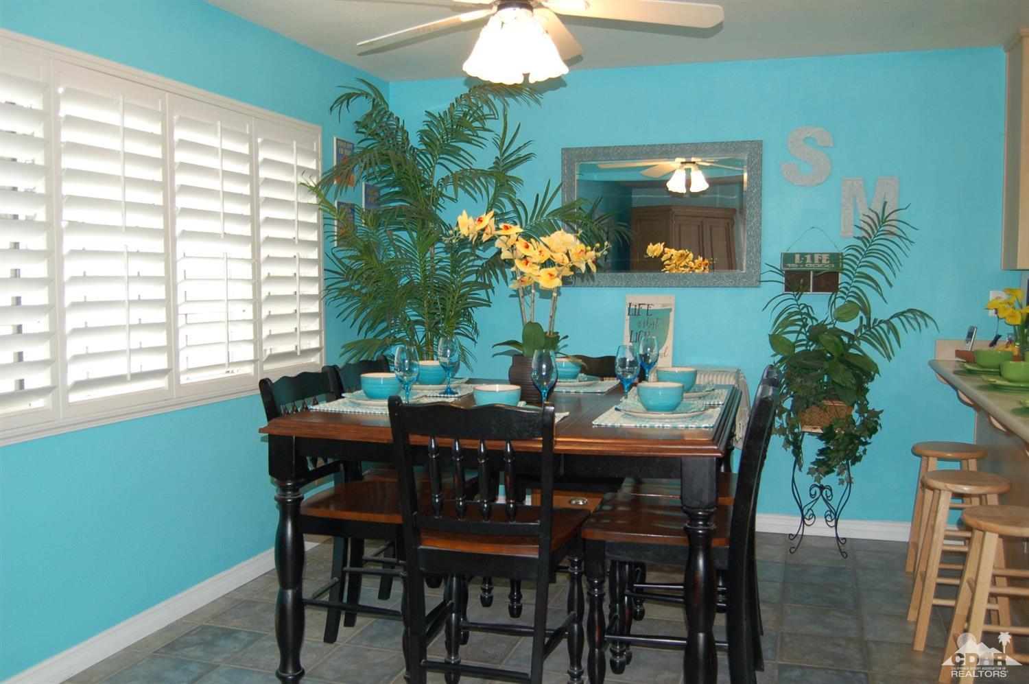 4591 Toyon Road Riverside, CA 92504 - Photo 16 of 40 a view of a dining room with furniture and chandelier