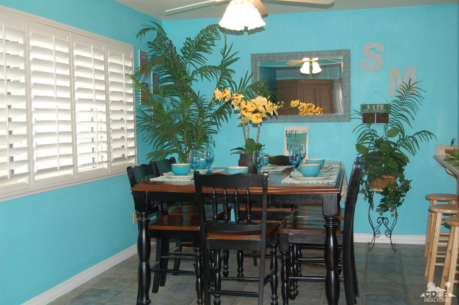 4591 Toyon Road Riverside, CA 92504 - Photo 17 of 40 a view of a dining room with furniture and chandelier