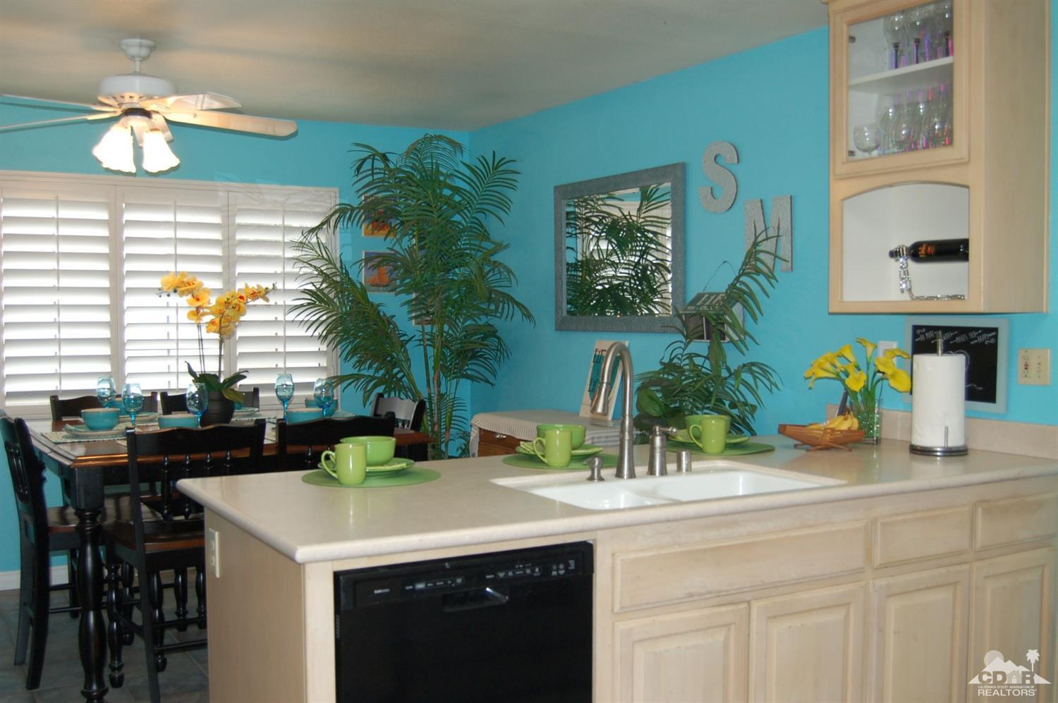 4591 Toyon Road Riverside, CA 92504 - Photo 18 of 40 a kitchen with a sink and a potted plant