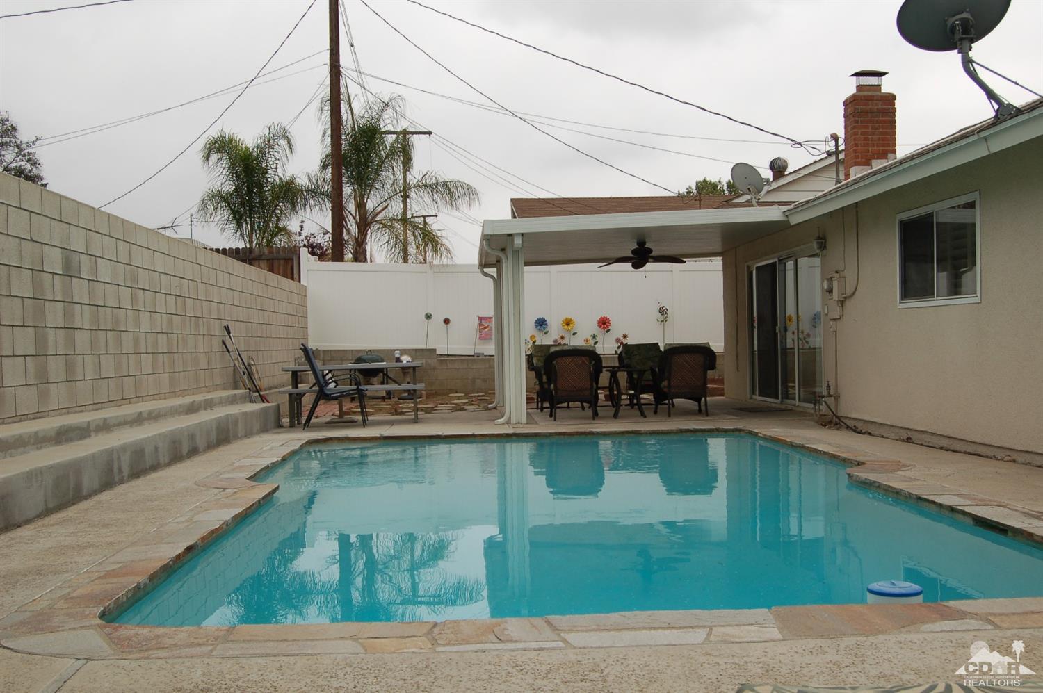 4591 Toyon Road Riverside, CA 92504 - Photo 3 of 40 a view of a swimming pool with a patio