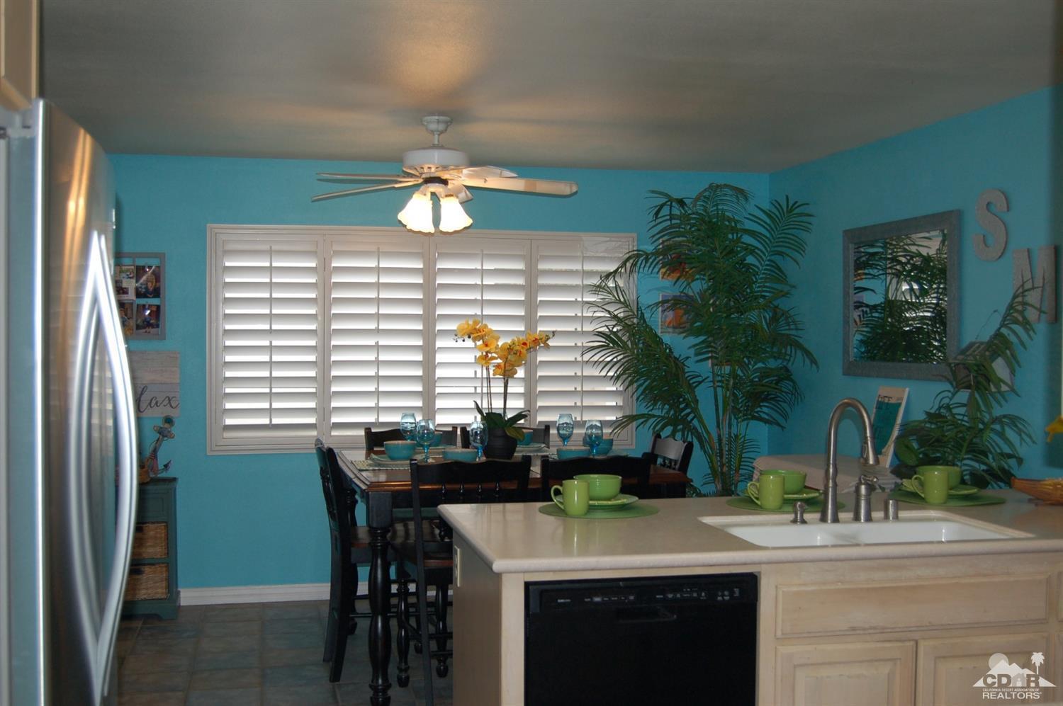 4591 Toyon Road Riverside, CA 92504 - Photo 23 of 40 a kitchen with a table and chairs