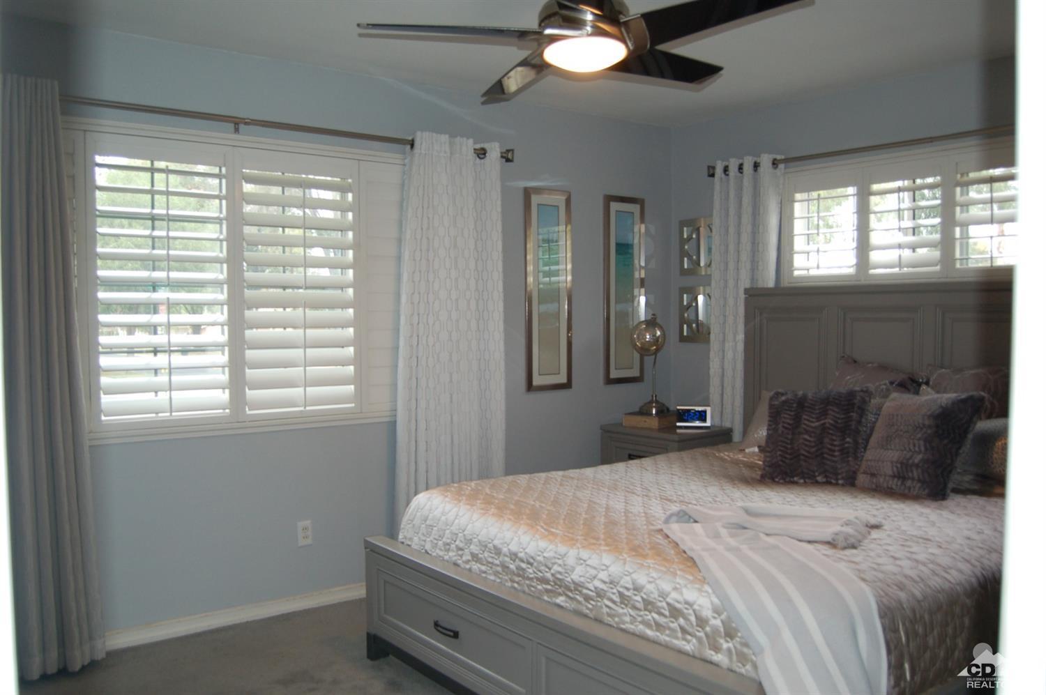 4591 Toyon Road Riverside, CA 92504 - Photo 30 of 40 a bedroom with a large bed and a window