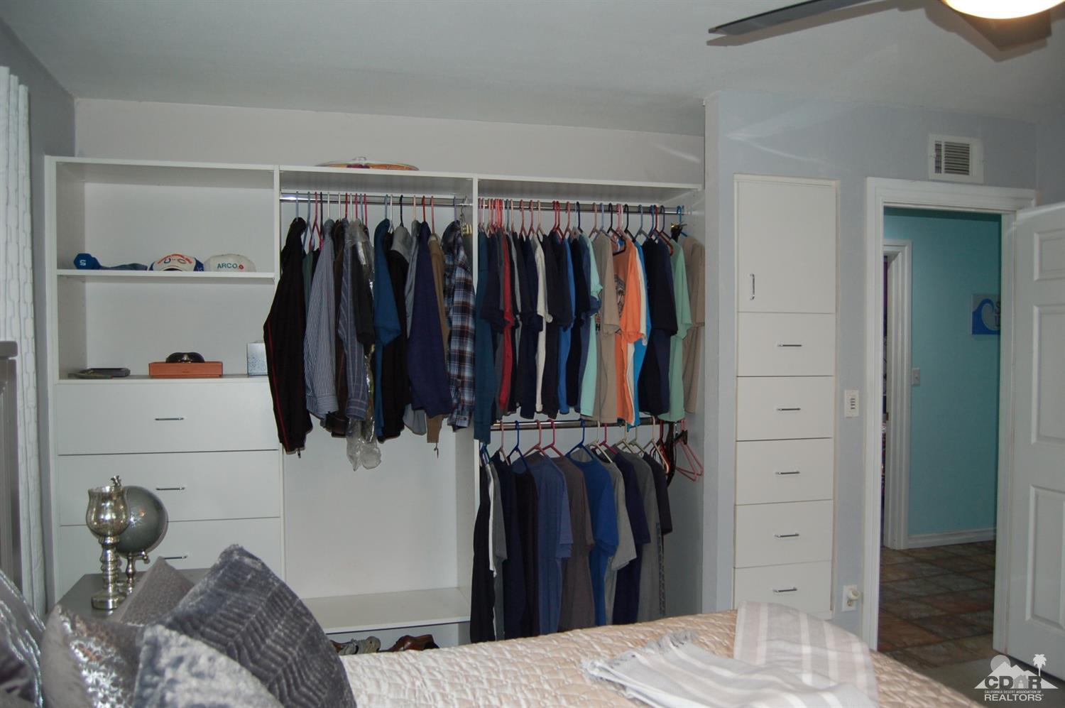 4591 Toyon Road Riverside, CA 92504 - Photo 33 of 40 a view of walk in closet with clothes and shoes