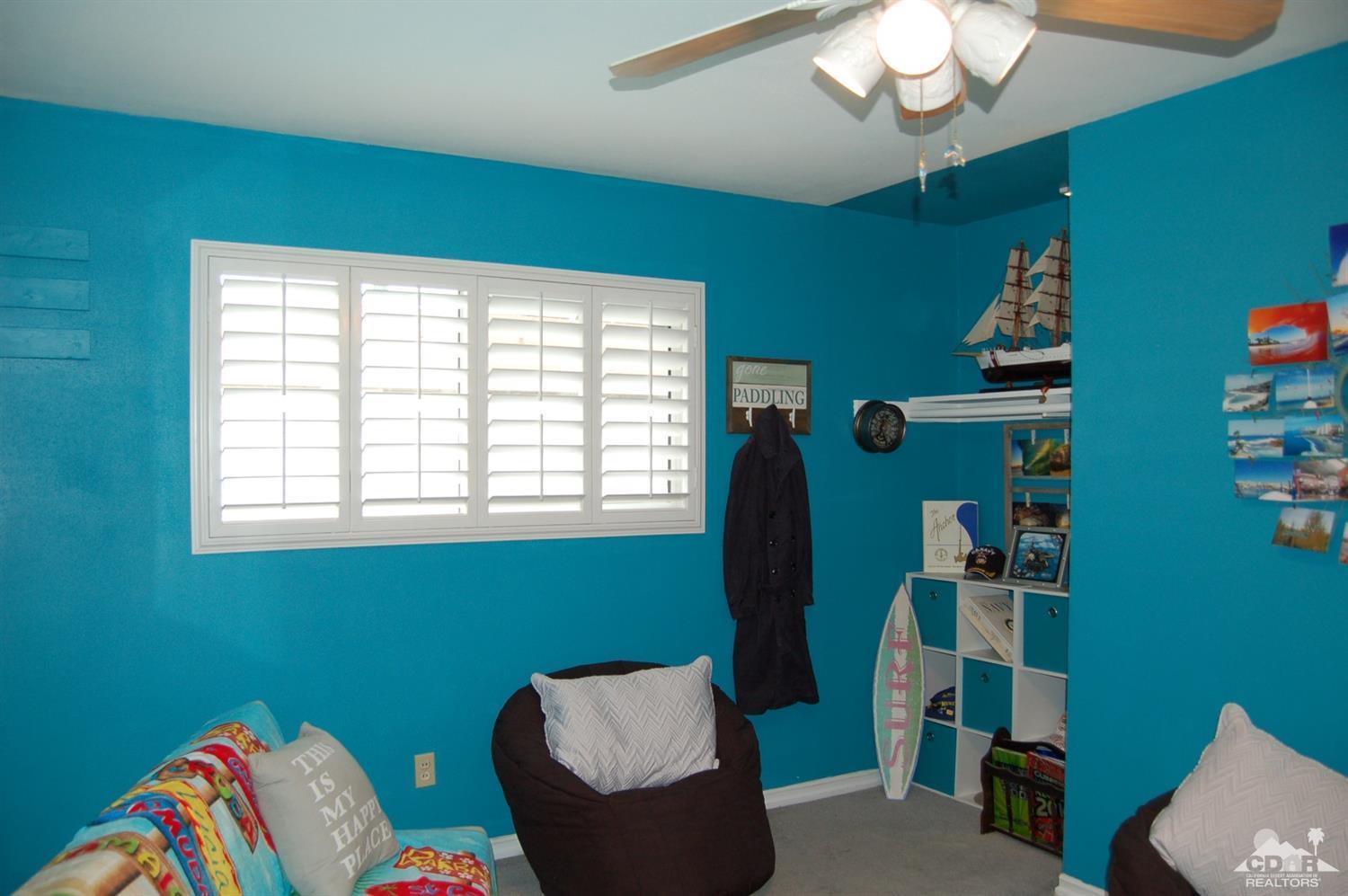 4591 Toyon Road Riverside, CA 92504 - Photo 35 of 40 a room with furniture and a window