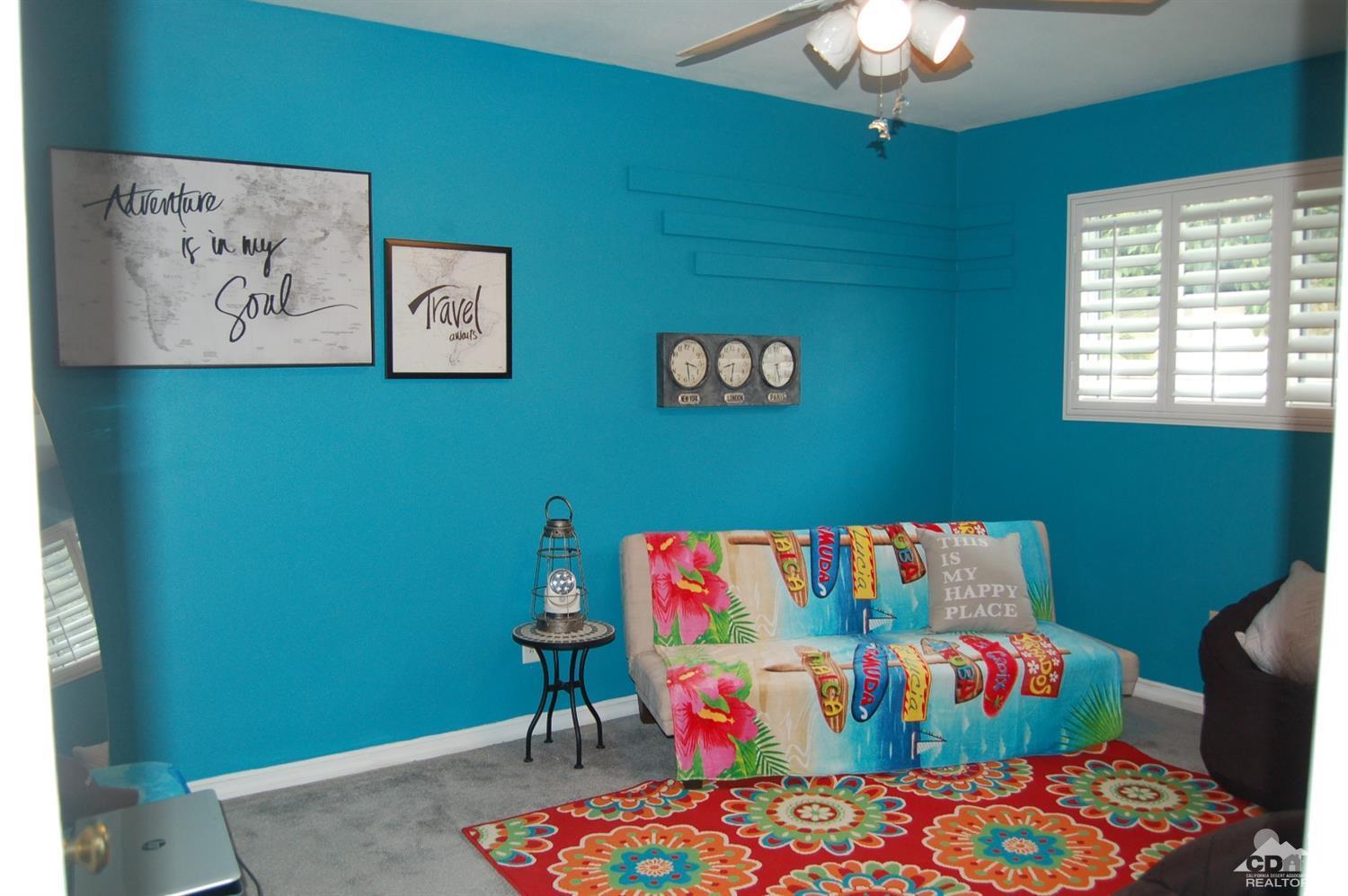 4591 Toyon Road Riverside, CA 92504 - Photo 36 of 40 a bedroom with a bed and a painting on the wall
