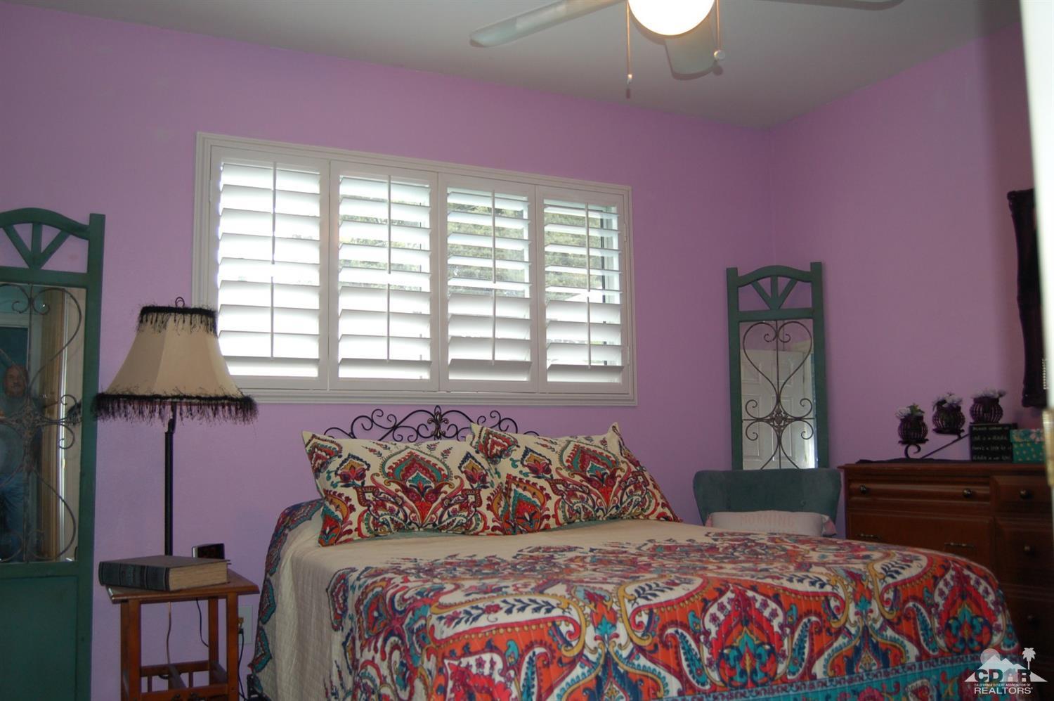 4591 Toyon Road Riverside, CA 92504 - Photo 39 of 40 a bedroom with a bed and a window