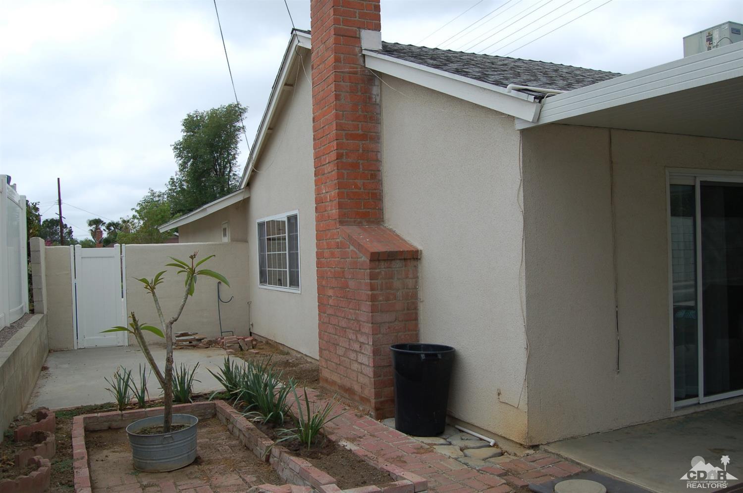 4591 Toyon Road Riverside, CA 92504 - Photo 7 of 40 a backyard of a house with table and chairs