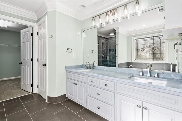 a bathroom with a double vanity sink mirror and