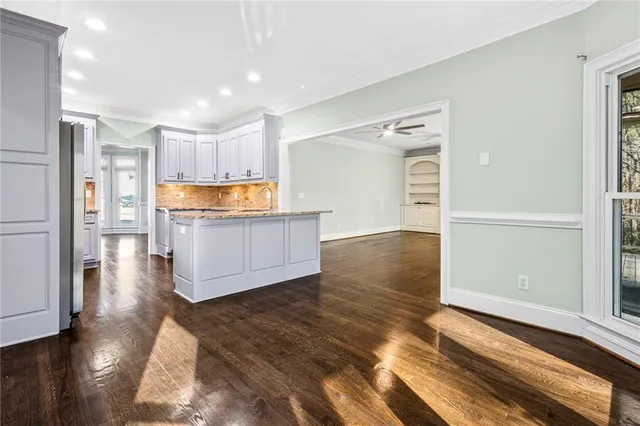 a view of kitchen and wooden floor