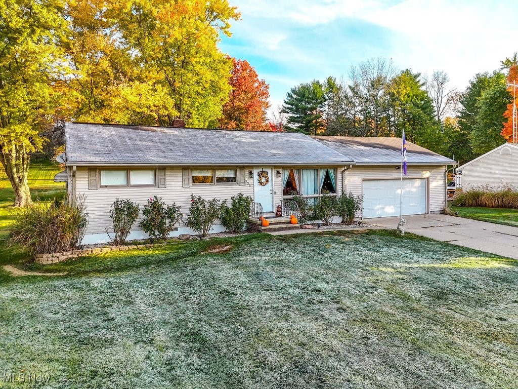 333 East Caston Road Akron, OH 44319 - Photo 2 of 42 Ranch-style home with a front lawn and a garage