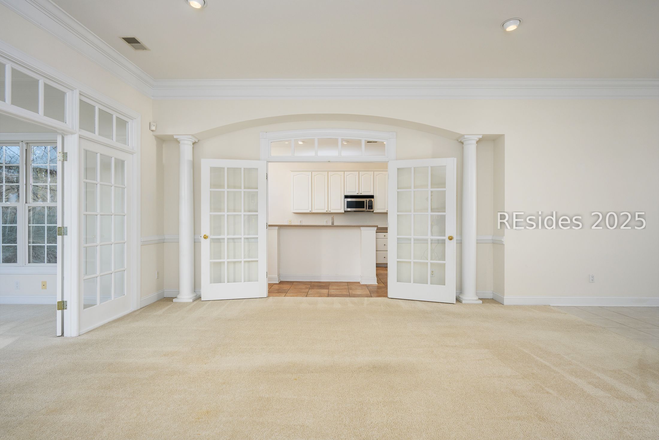 7 Crescent Circle Bluffton, SC 29910 - Photo 12 of 53 Glass French doors, transoms, and arched details.