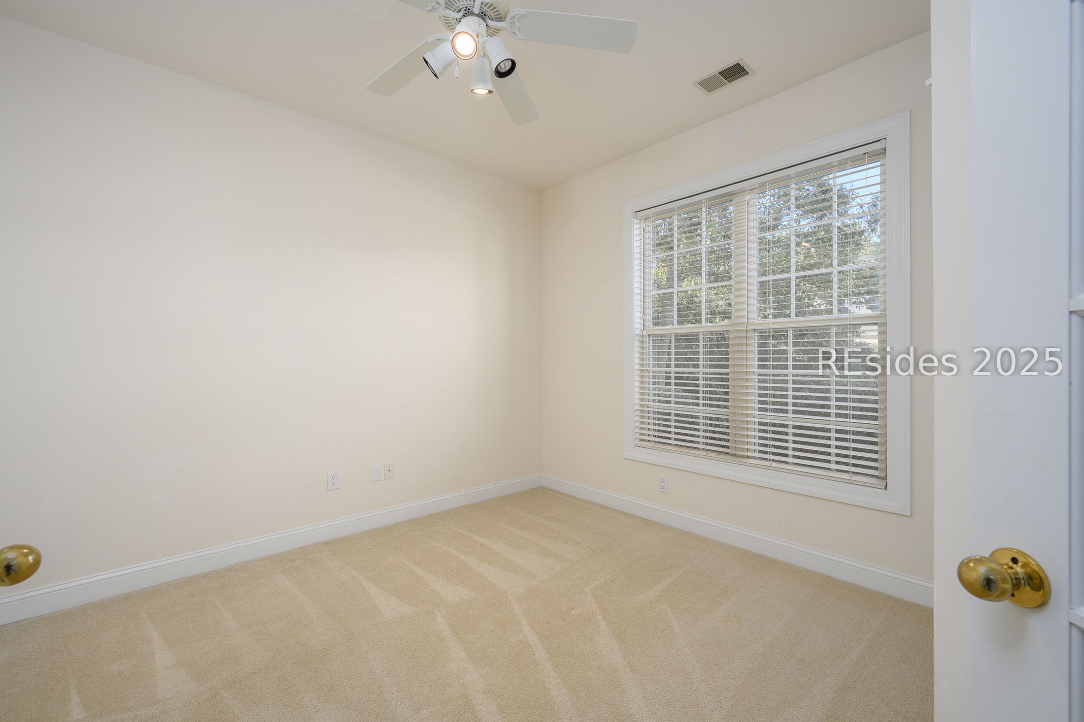 7 Crescent Circle Bluffton, SC 29910 - Photo 31 of 53 Double windows, carpeted floor, ceiling fan.