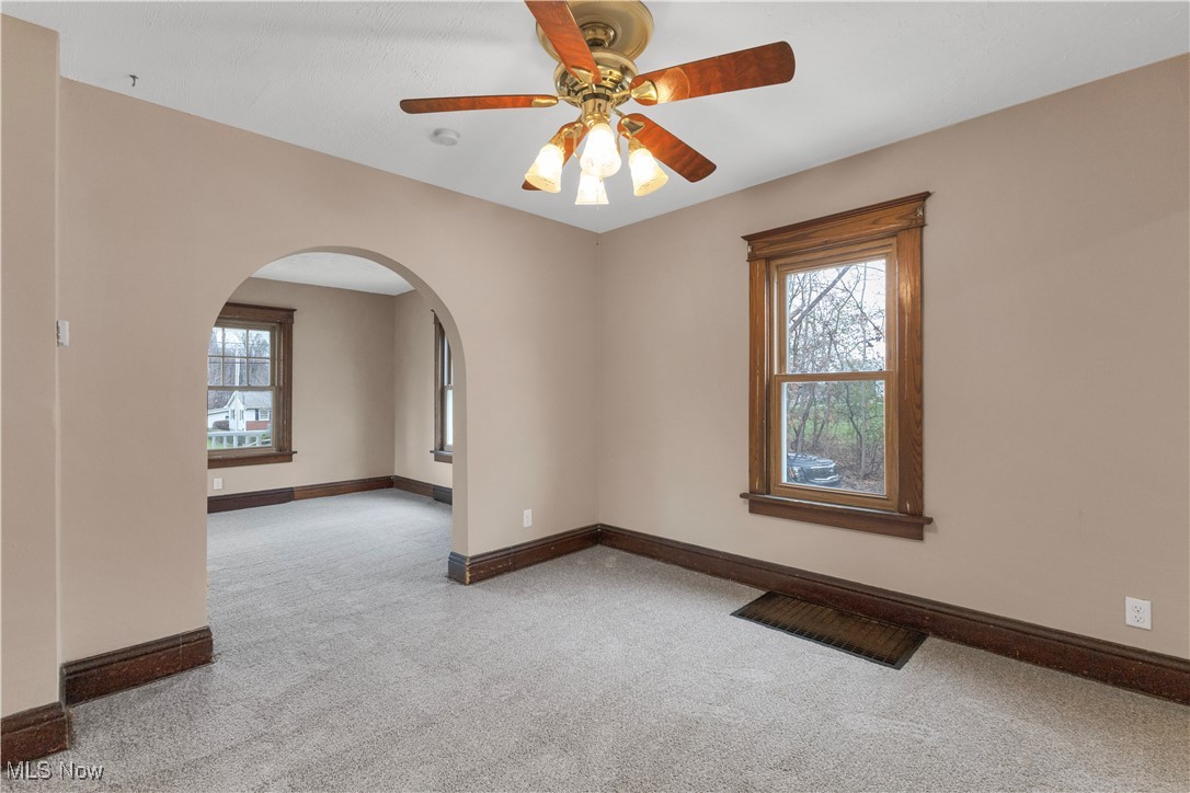48265 Middle Ridge Road Amherst, OH 44001 - Photo 10 of 43 Formal dining room with freshly painted walls and new carpeting. Overhead ceiling fan and window.