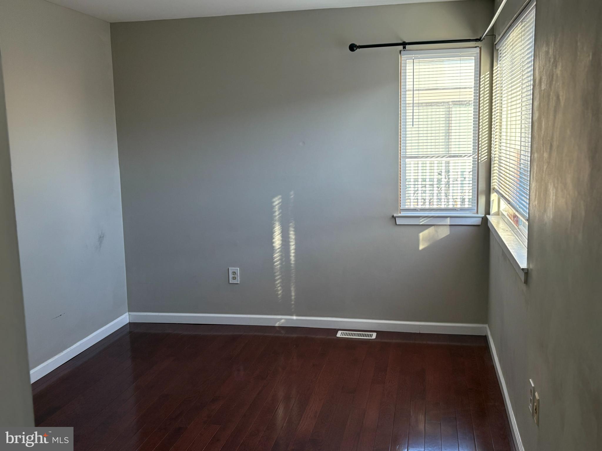 904 Gregorys Way Voorhees, NJ 08043 - Photo 11 of 19 a view of an empty room with wooden floor and a window
