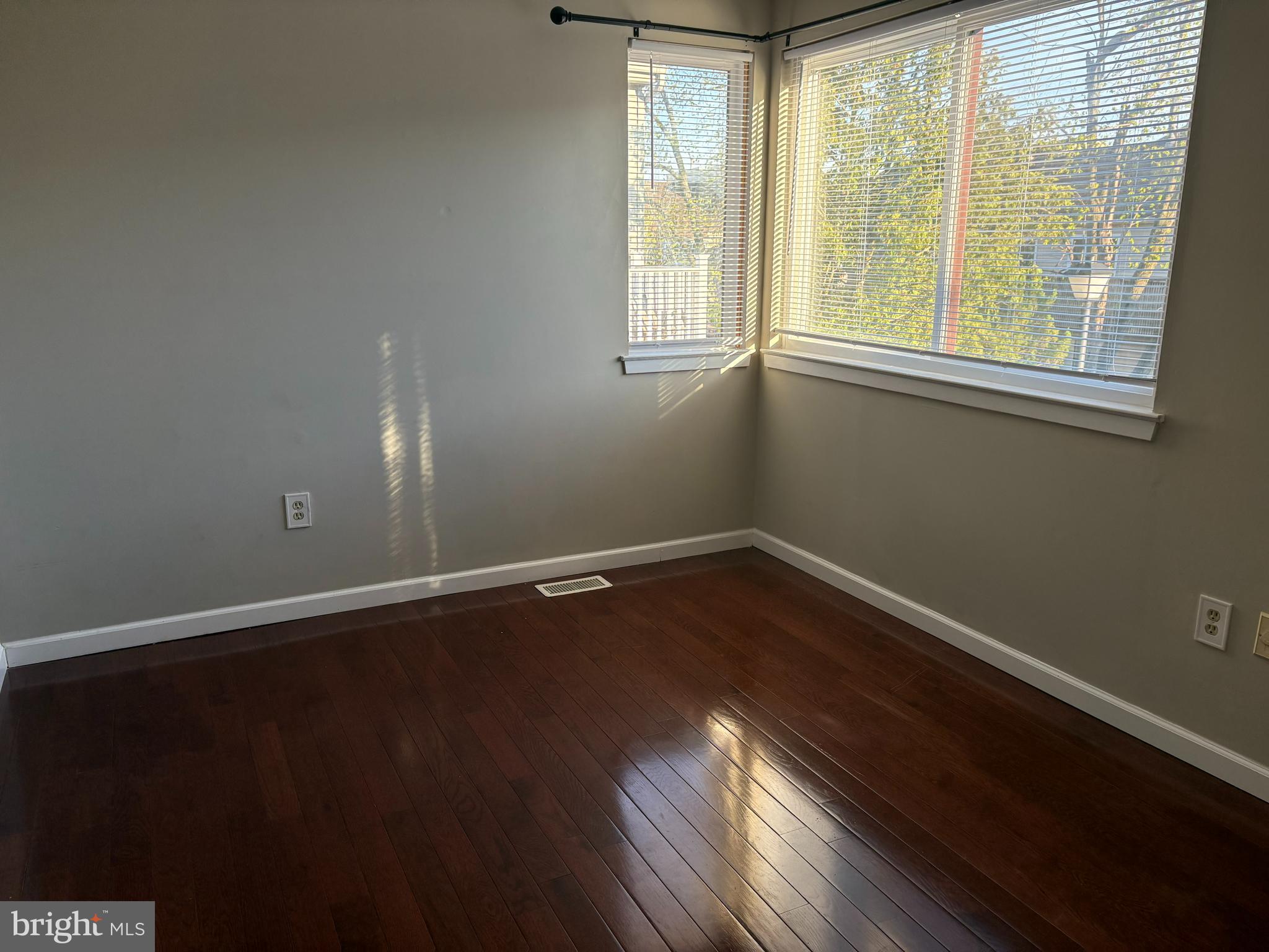 904 Gregorys Way Voorhees, NJ 08043 - Photo 7 of 19 a view of an empty room with wooden floor and a window