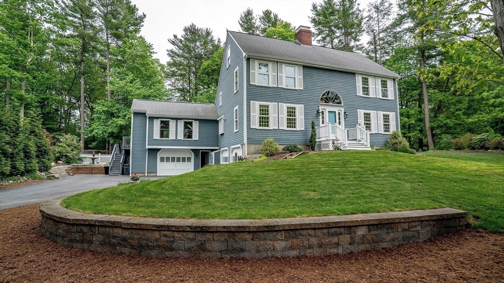 142 Baker Street Walpole, MA 02081 - Photo 5 of 42 a view of a house with a backyard