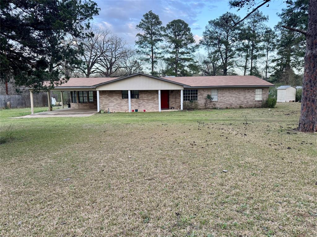 1100 Chipper Lane Keithville, LA 71047 - Photo 1 of 1 a front view of a house with a garden