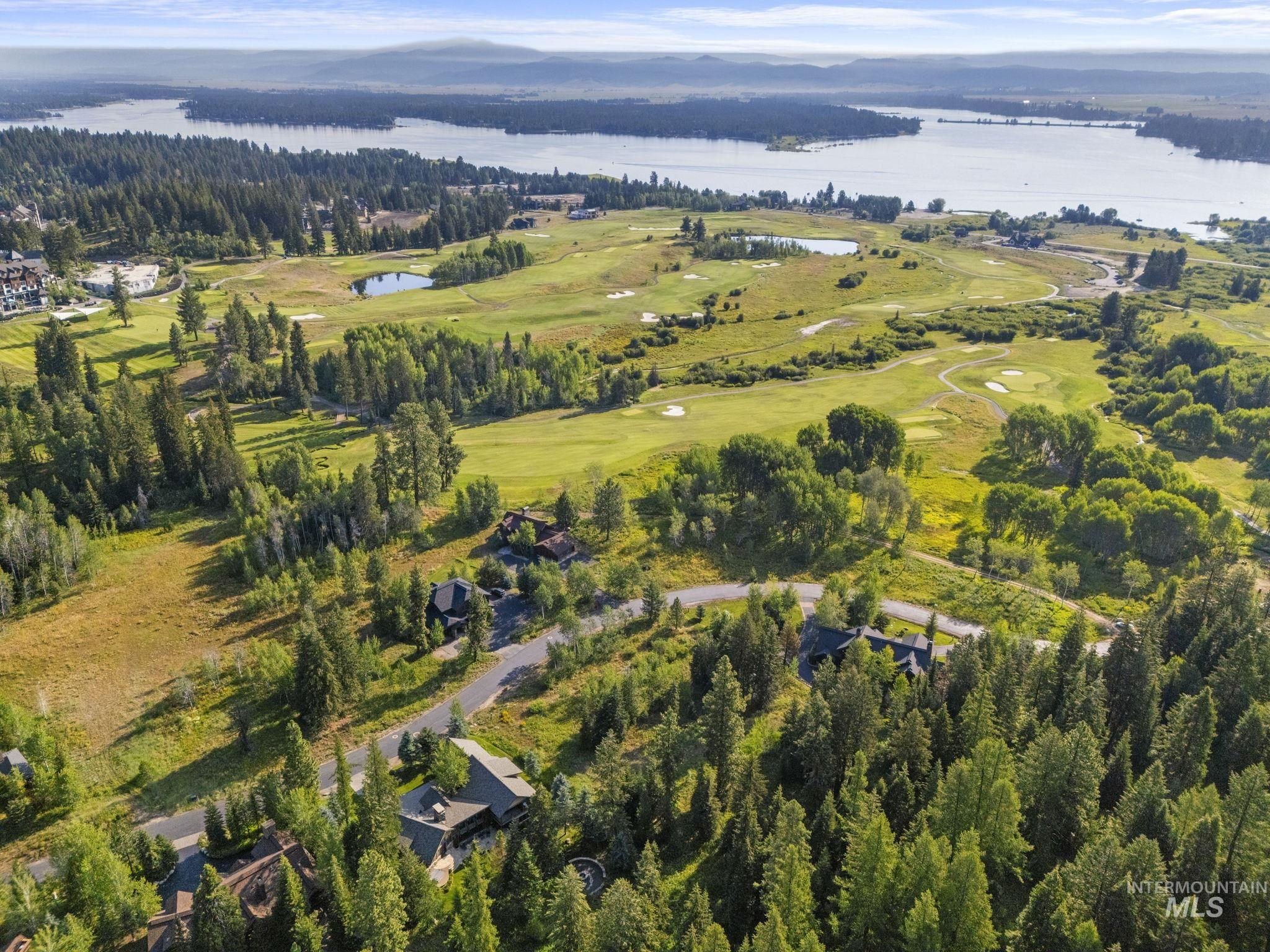 459 Discovery Drive Cascade, ID 83611 - Photo 10 of 17 Aerial view of property and surrounding area featuring a nearby body of water and a local golf course