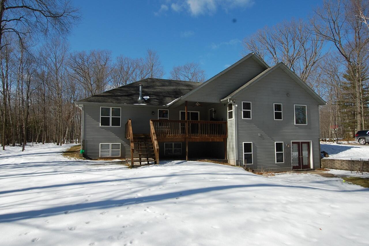 8760 Rambling Way Canadian Lakes, MI 49346 - Photo 2 of 28 2 Back of home