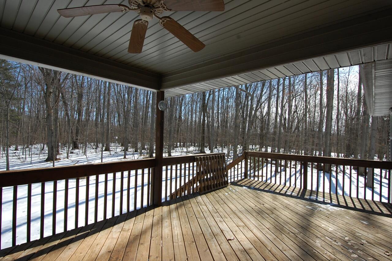 8760 Rambling Way Canadian Lakes, MI 49346 - Photo 22 of 28 23 Covered Porch Area
