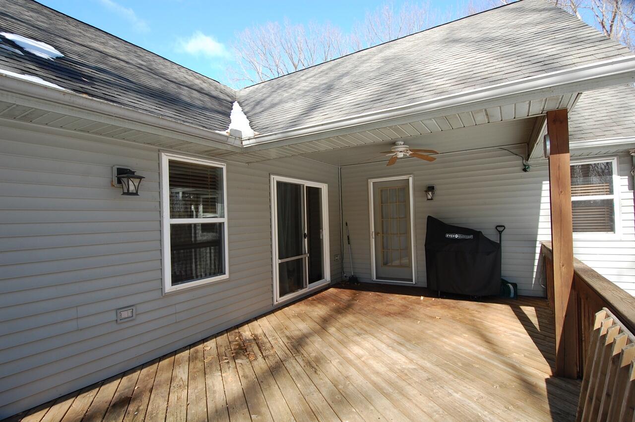 8760 Rambling Way Canadian Lakes, MI 49346 - Photo 23 of 28 24 Deck with steps down