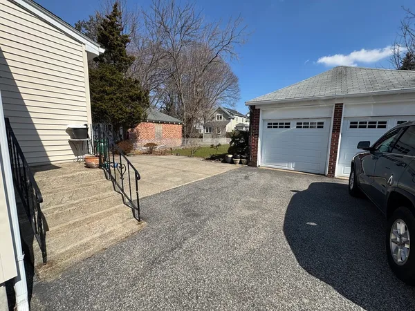 a view of a car park in front of house