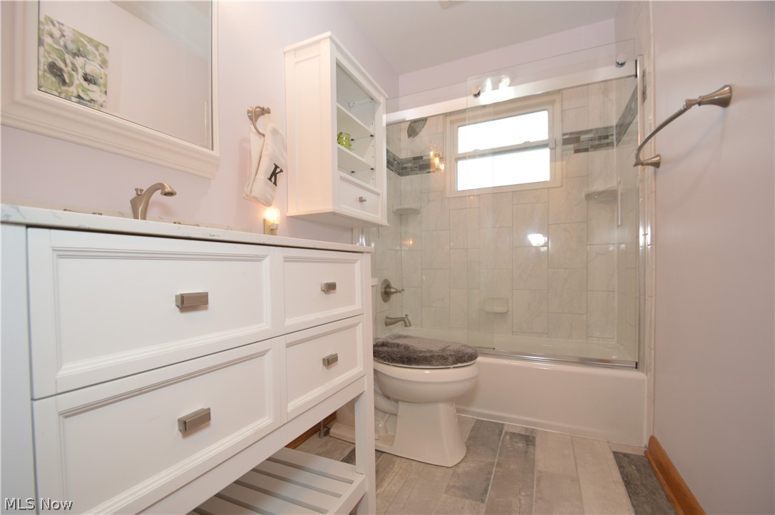 1497 Saxe Road Mogadore, OH 44260 - Photo 8 of 26 Completely updated full bath (2nd/main level). Spa-inspired white and gray color palate with tiled tub surround.
