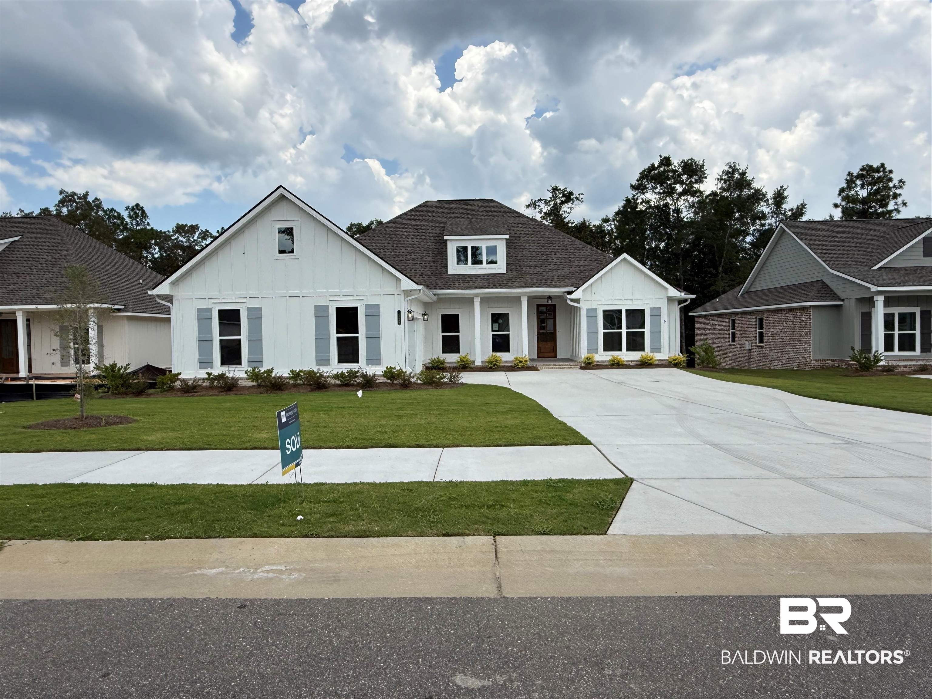 12232 Exbury Way Daphne, AL 36527 - Photo 1 of 33 Modern inspired farmhouse featuring board and batten siding, driveway, and a front lawn