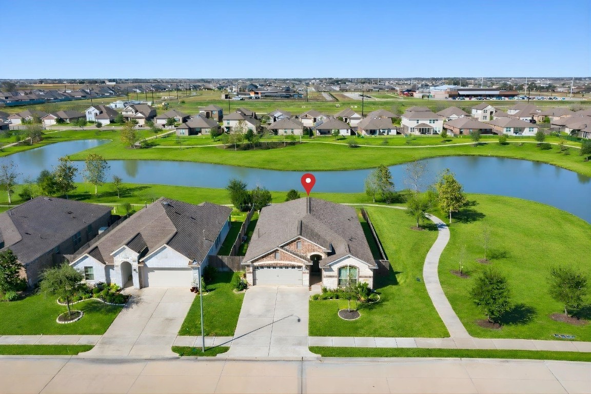 5402 Still Creek Ranch Drive Richmond, TX 77469 - Photo 1 of 32 an aerial view of a house with outdoor space lake view and mountain view in back