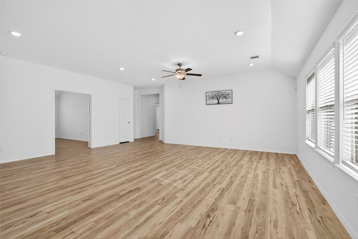 5402 Still Creek Ranch Drive Richmond, TX 77469 - Photo 11 of 32 wooden floor in an empty room with a window