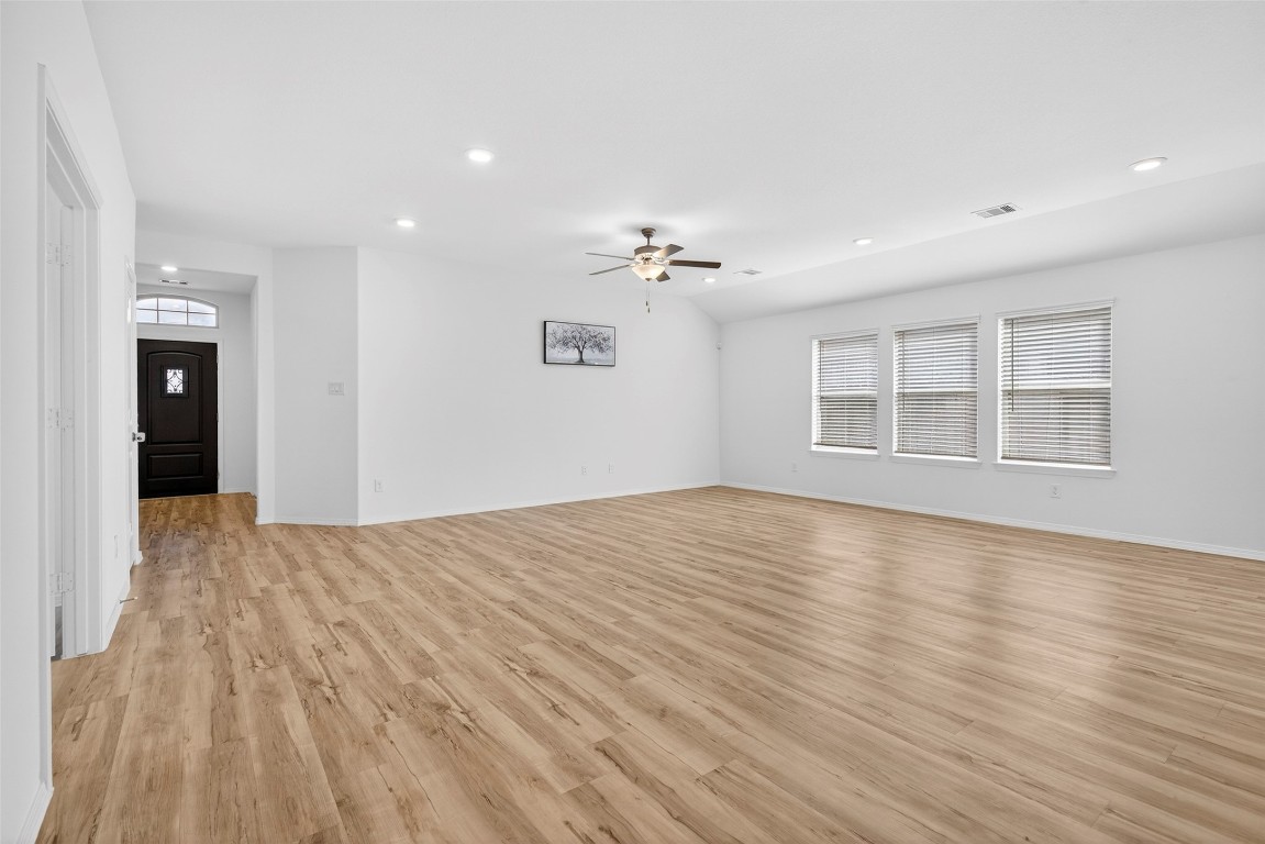 5402 Still Creek Ranch Drive Richmond, TX 77469 - Photo 12 of 32 a view of empty room with wooden floor and fan