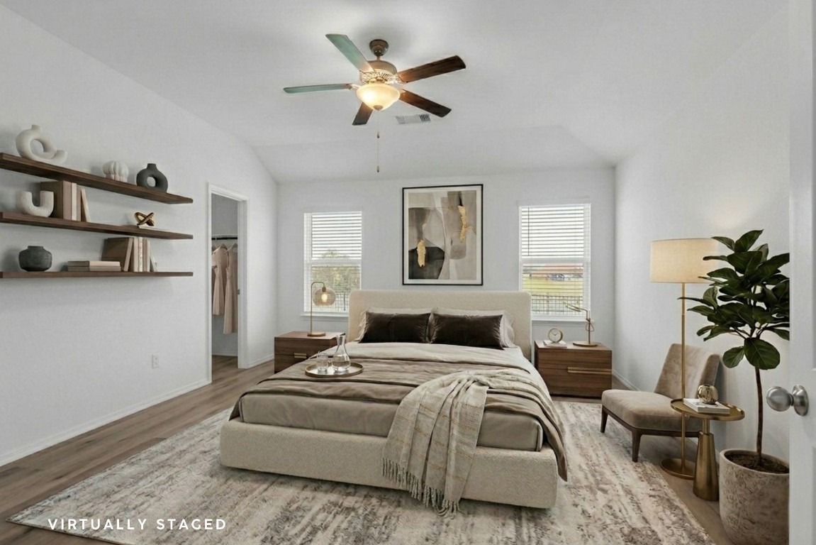 5402 Still Creek Ranch Drive Richmond, TX 77469 - Photo 2 of 32 a bedroom with a bed and a couch