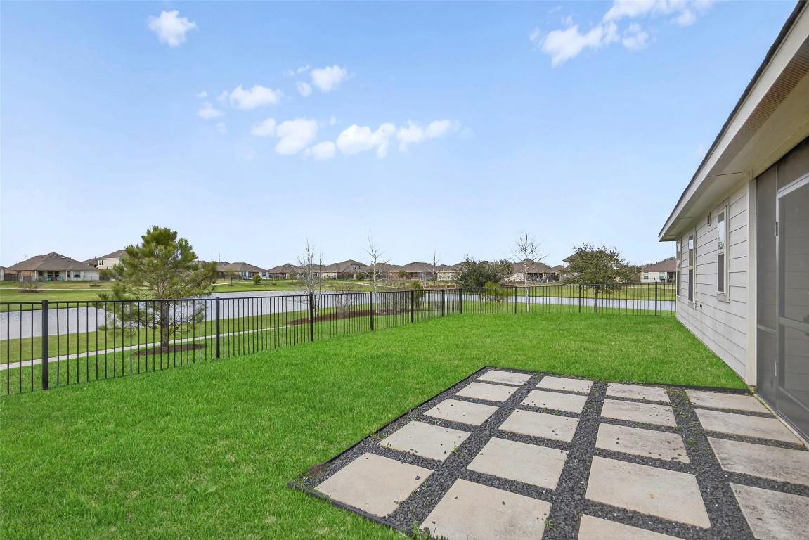 5402 Still Creek Ranch Drive Richmond, TX 77469 - Photo 29 of 32 a view of a backyard with grass