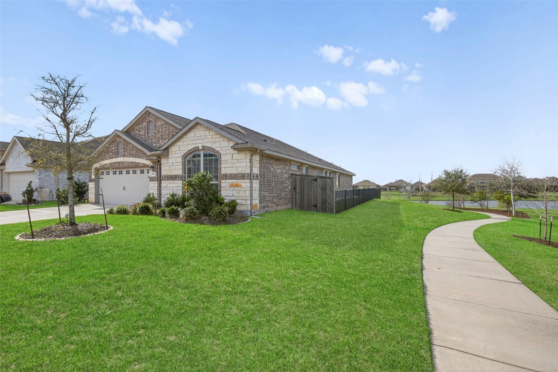 5402 Still Creek Ranch Drive Richmond, TX 77469 - Photo 7 of 32 a view of a house with a big yard plants and large trees