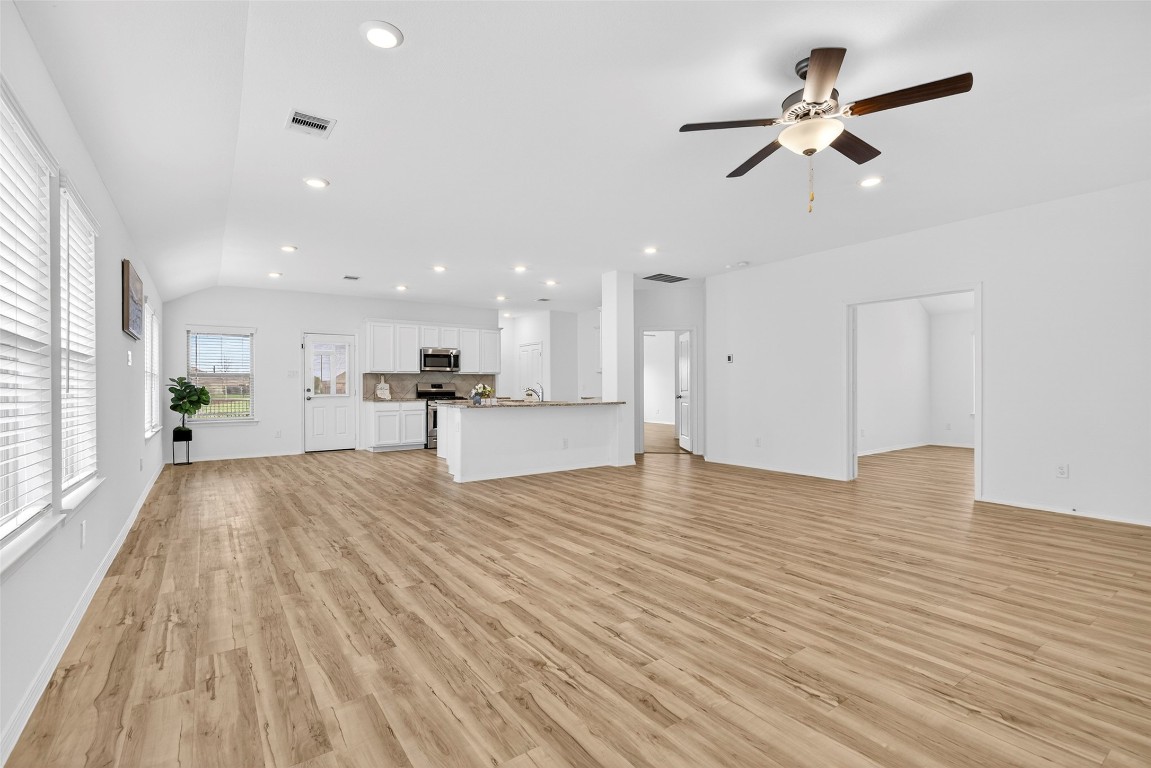 5402 Still Creek Ranch Drive Richmond, TX 77469 - Photo 10 of 32 a view of kitchen with cabinets and wooden floor