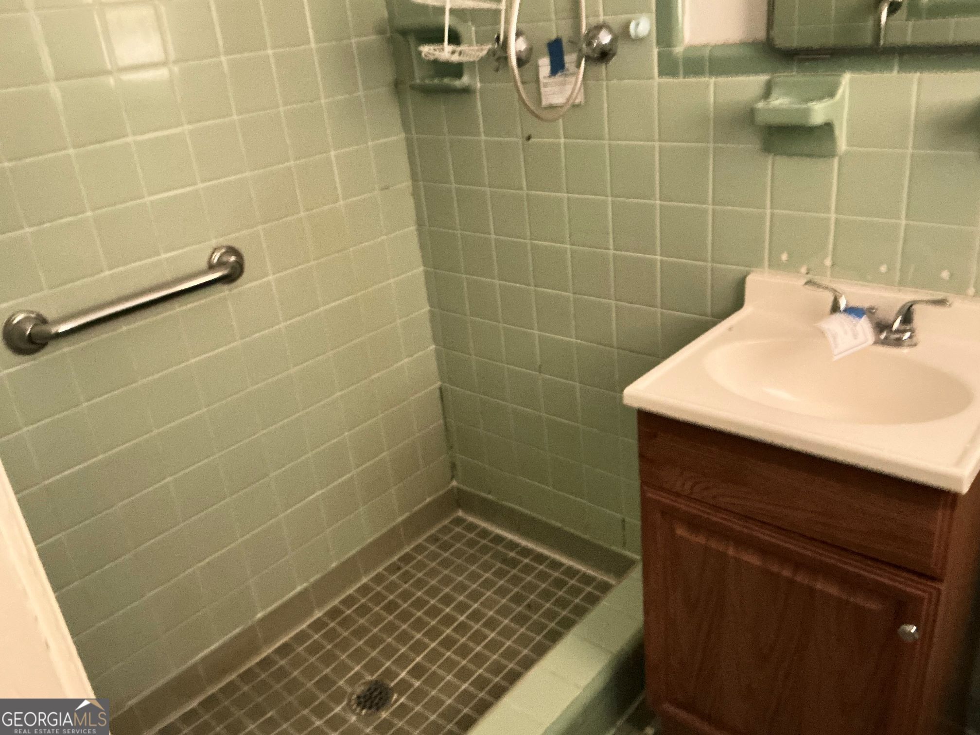 135 Brookside Drive Elberton, GA 30635 - Photo 22 of 22 a bathroom with a sink toilet and shower