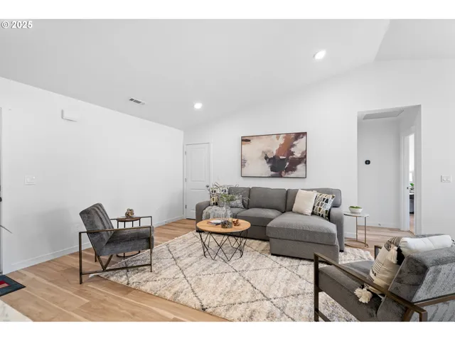 a living room with furniture and a rug