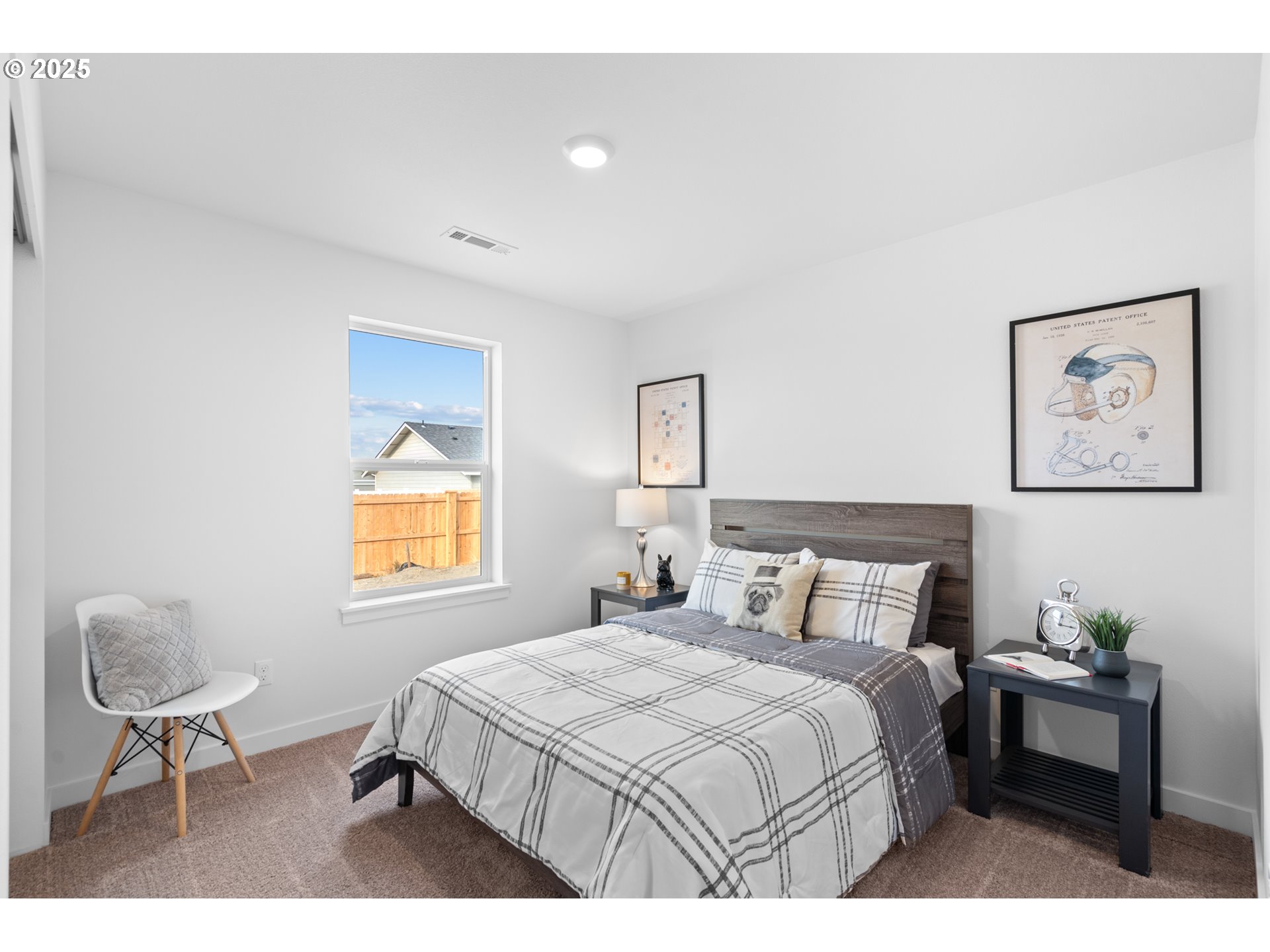 218 Southwest Sparrow Street Boardman, OR 97818 - Photo 18 of 23 a bedroom with a bed and a chair