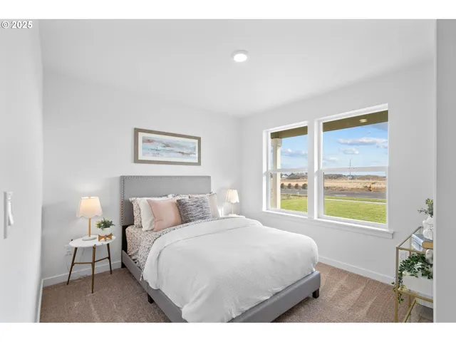 a bedroom with a bed and a night stand