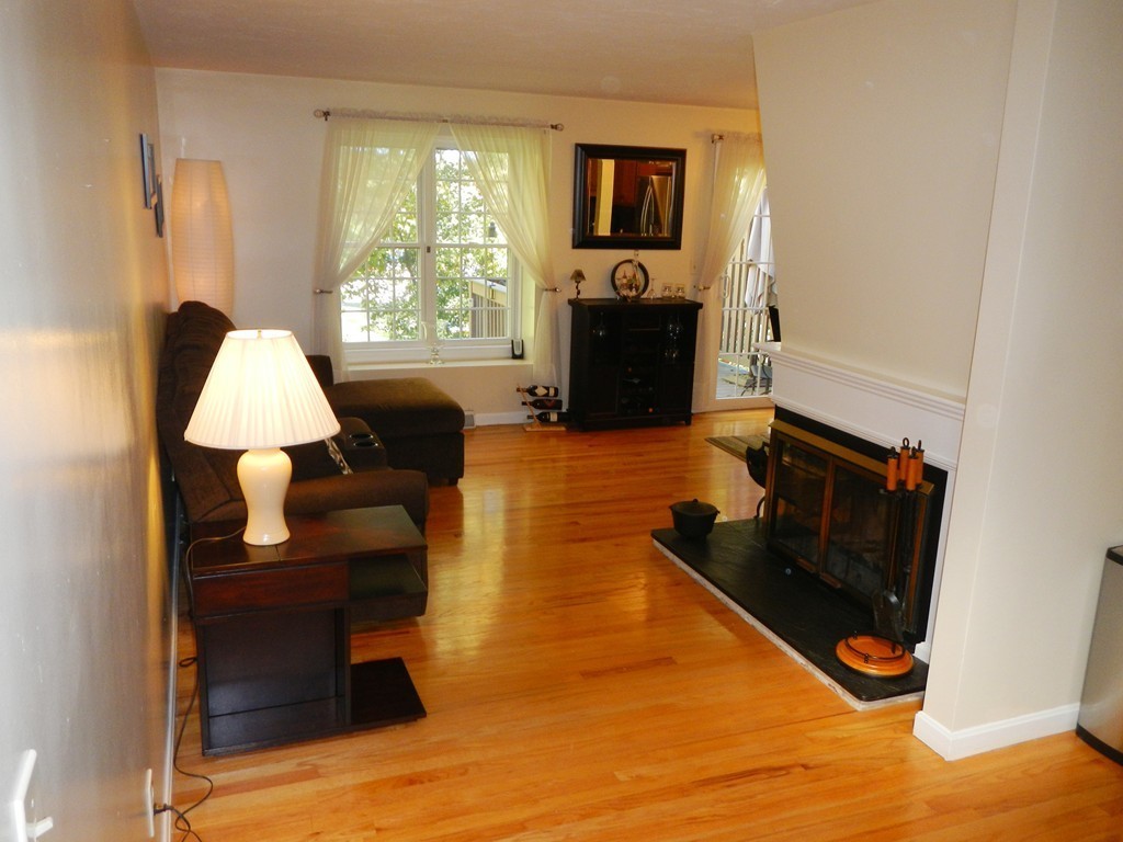 208 B Ridgefield Circle, Unit B Clinton, MA 01510 - Photo 3 of 24 a living room with furniture window and a flat screen tv