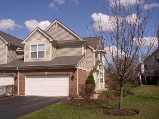 1728 Brookwood Road, Unit 1728 Lisle, IL 60532 - Photo 1 of 1 a front view of a house with a yard and garage
