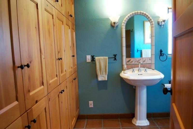 1021 Laguna Street, Unit 4 Santa Barbara, CA 93101 - Photo 11 of 13 a bathroom with a sink a mirror and a shower