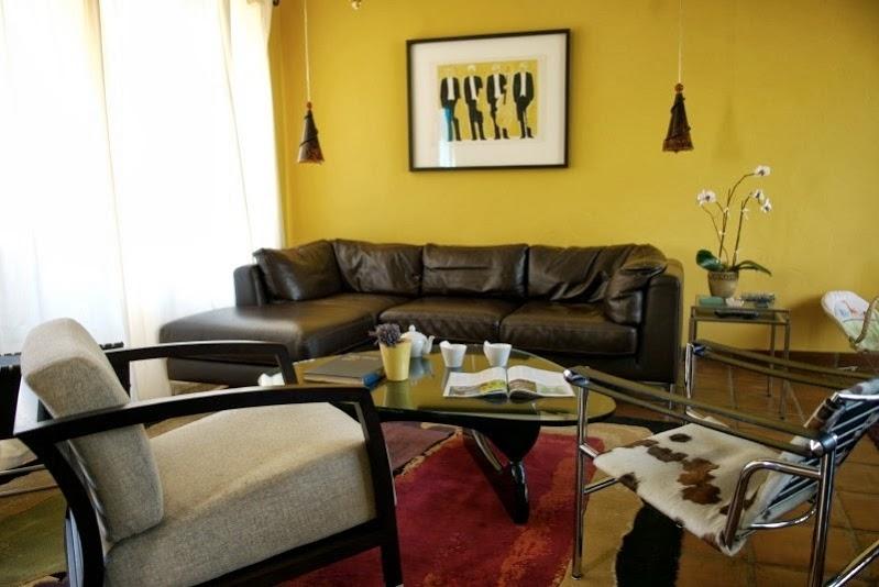 1021 Laguna Street, Unit 4 Santa Barbara, CA 93101 - Photo 2 of 13 a living room with furniture and wooden floor